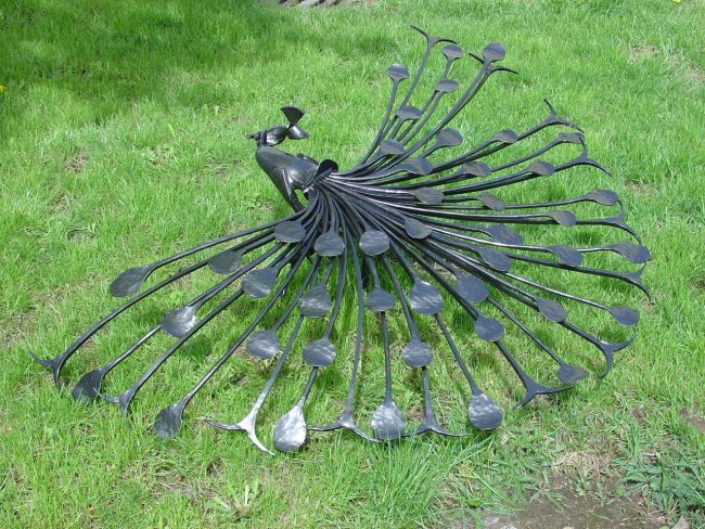 Beautiful peacock made of forged elements