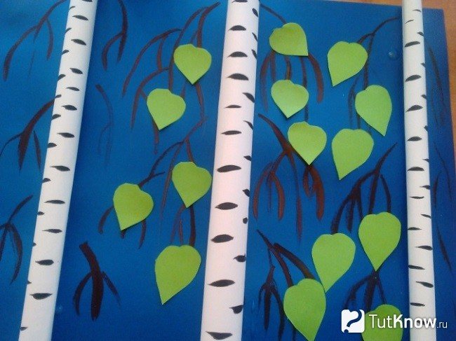 Drawing twigs and gluing paper leaves