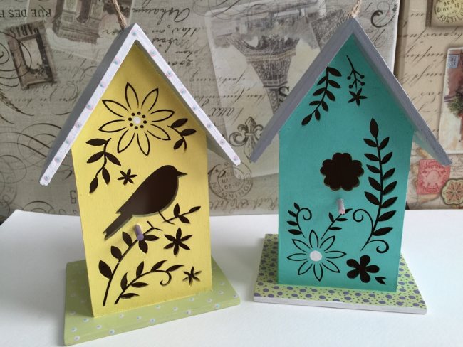 Birdhouses with bird feeders can be made multi-colored or even carved